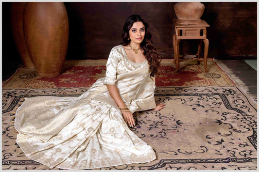 Graceful off-white Banarasi Silk Saree with Zari Accents & Embroidered Blouse