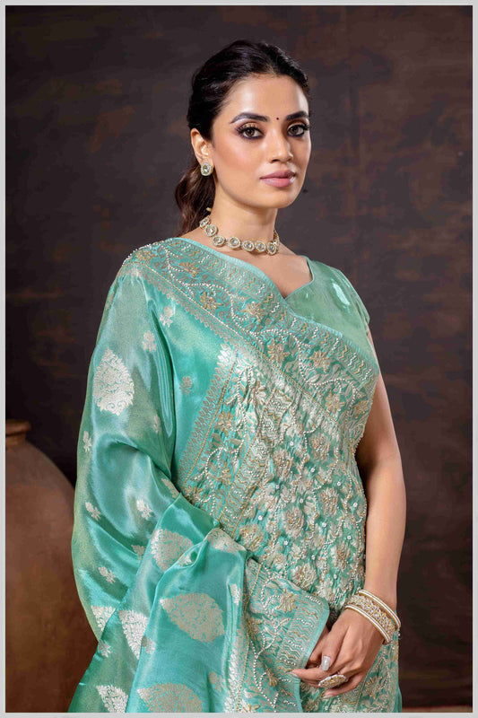 Aqua Elegance: Tissue Silk Saree with Gold Zari Woven Details