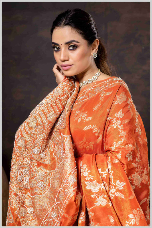 Grace in Bloom: Rust Orange Tissue Saree with Woven Floral Vines