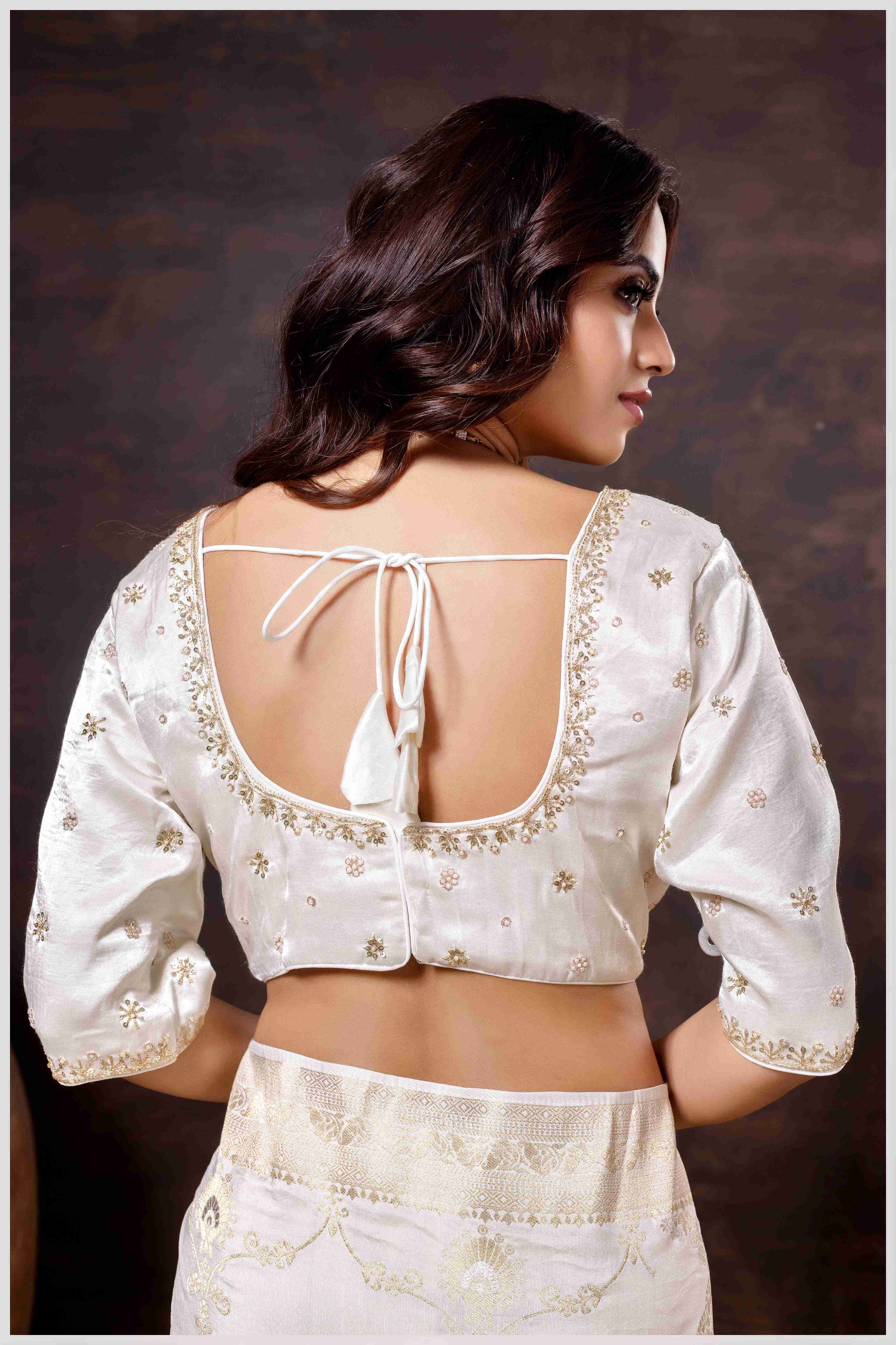 Graceful off-white Banarasi Silk Saree with Zari Accents & Embroidered Blouse