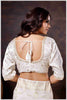 Graceful off-white Banarasi Silk Saree with Zari Accents & Embroidered Blouse