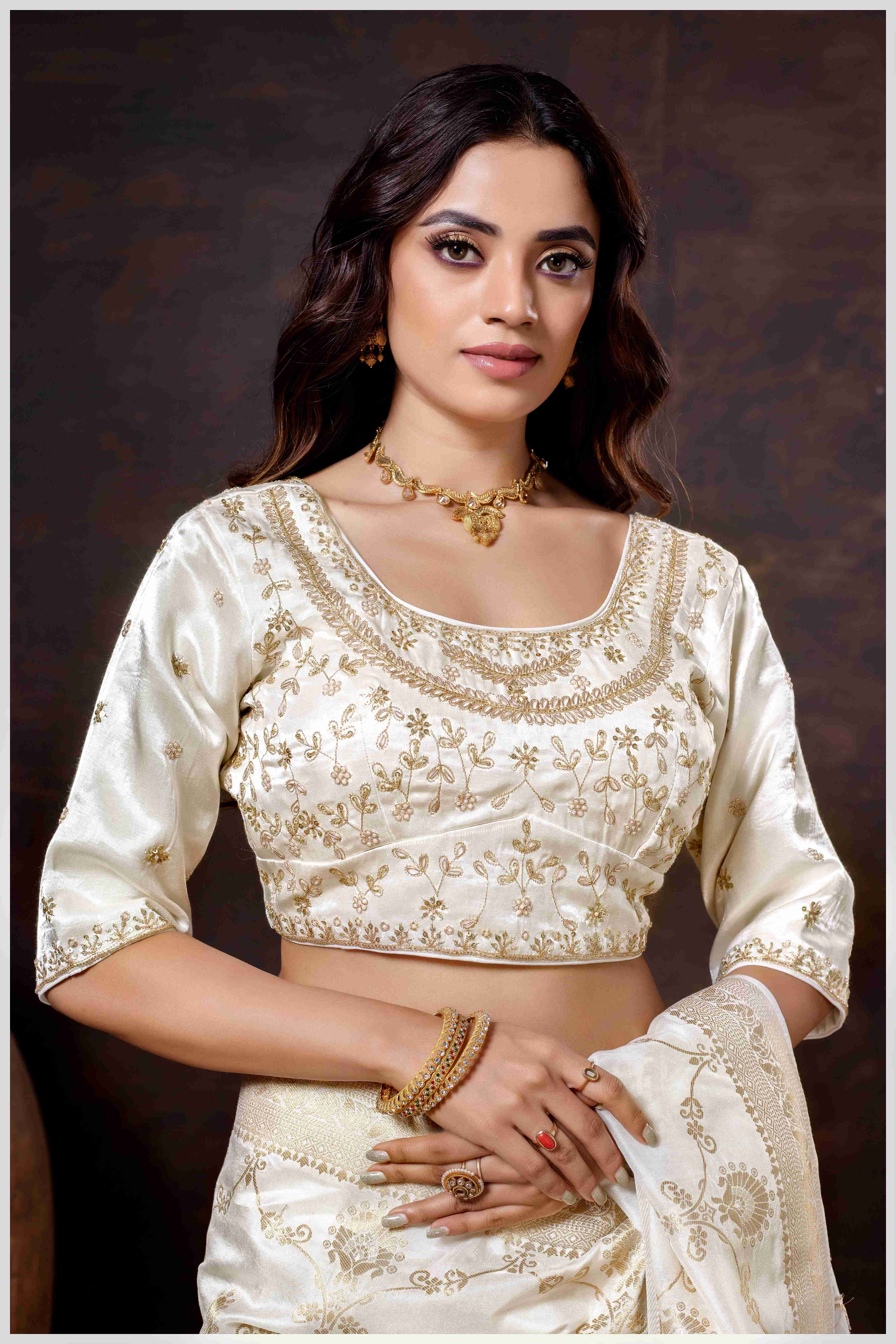 Graceful off-white Banarasi Silk Saree with Zari Accents & Embroidered Blouse