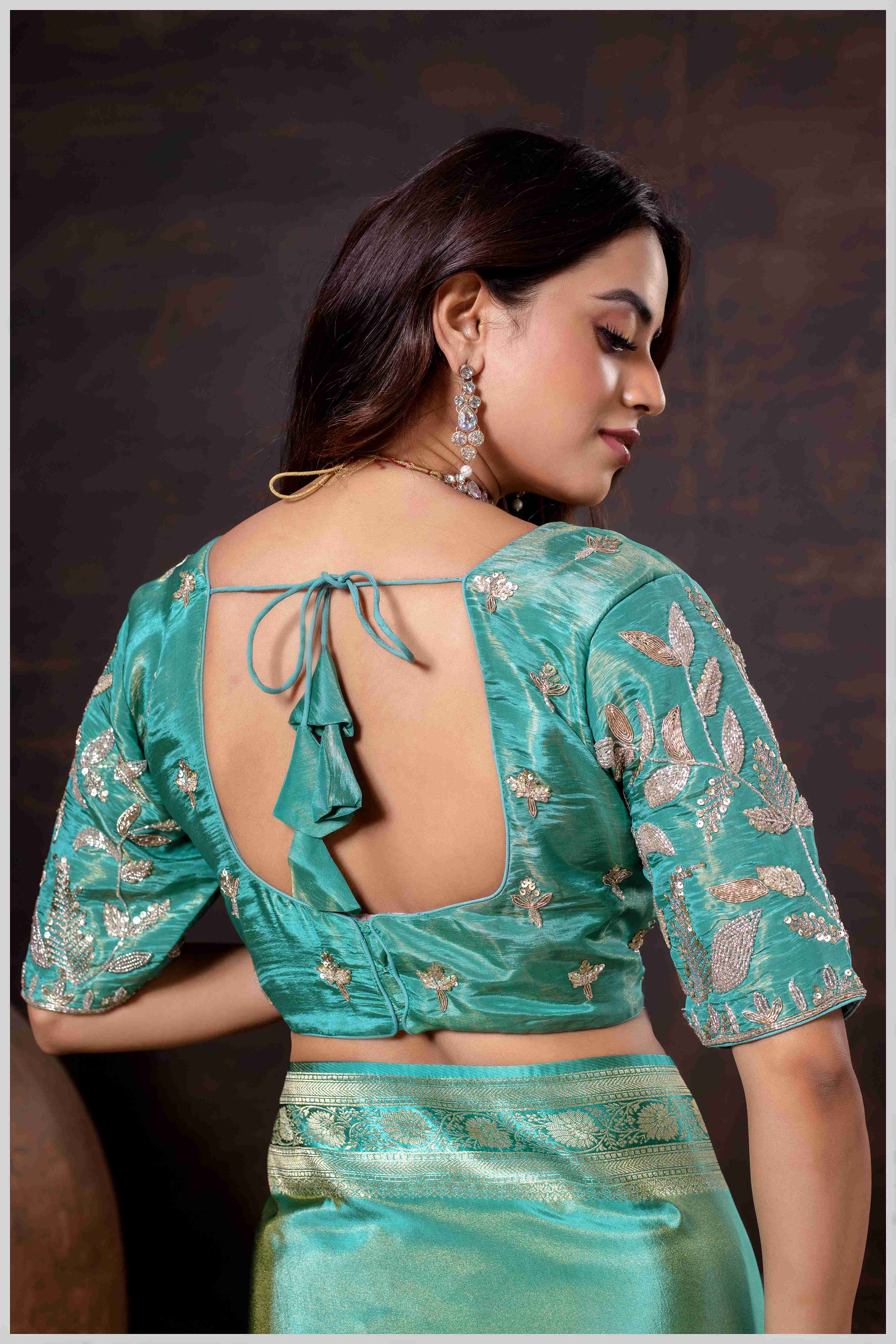 Elegant Aqua Green Designer Tissue Saree with Embellished Blouse.