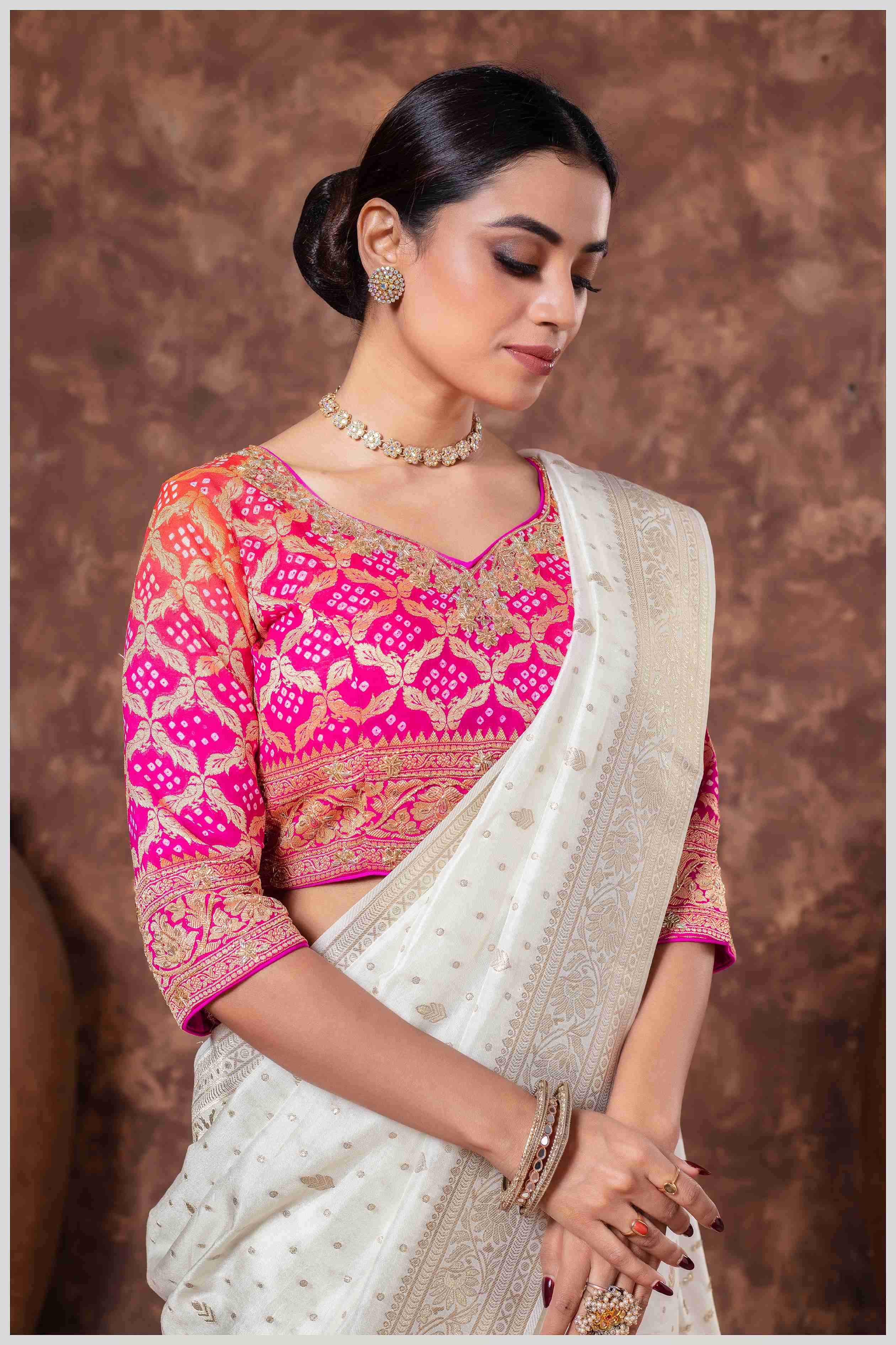 Royal Radiance: Off White Banarasi Saree & Pink Blouse with Silver Zari Detailing