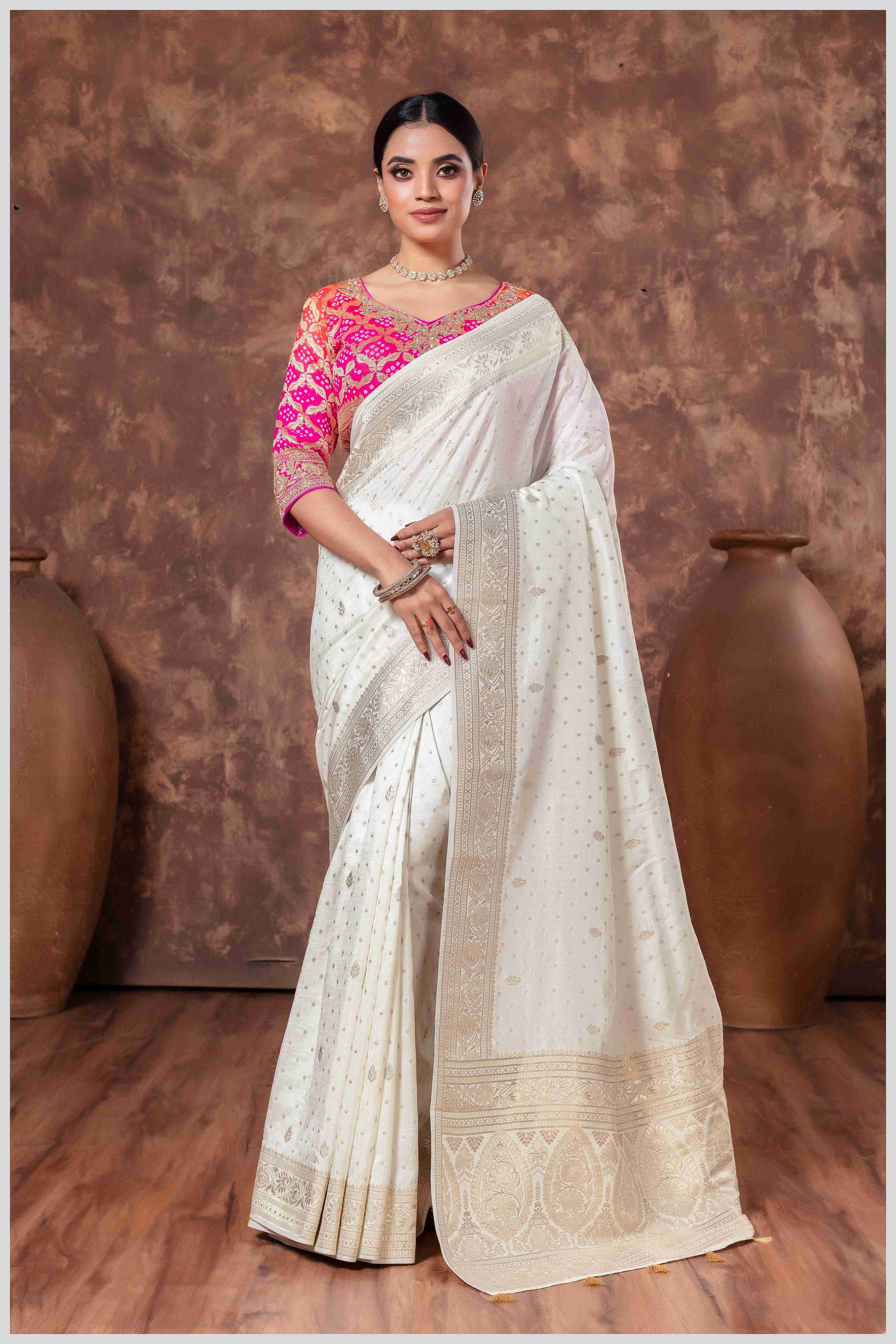Royal Radiance: Off White Banarasi Saree & Pink Blouse with Silver Zari Detailing