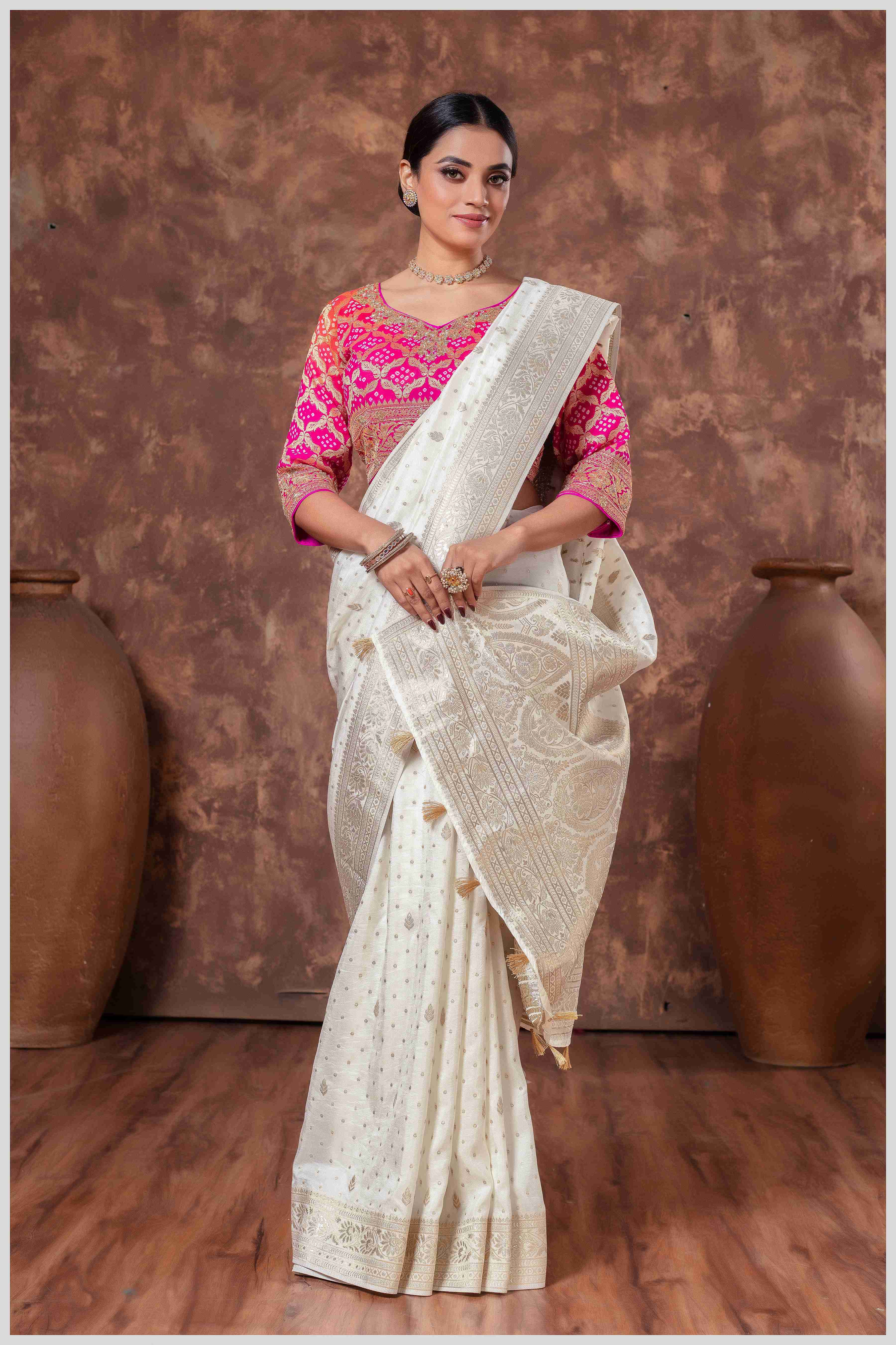 Royal Radiance: Off White Banarasi Saree & Pink Blouse with Silver Zari Detailing