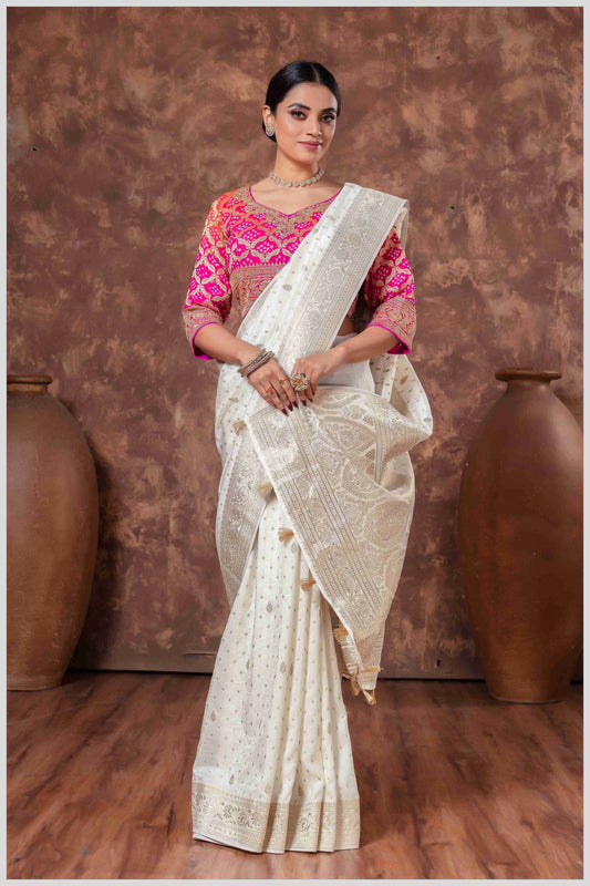 Royal Radiance: Off White Banarasi Saree & Pink Blouse with Silver Zari Detailing