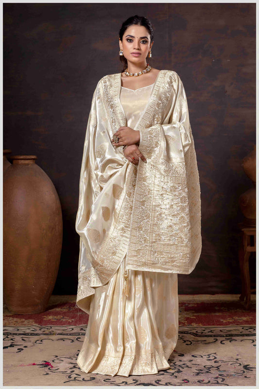 Off White Elegance: Tissue Silk Saree with Gold Zari Woven Details
