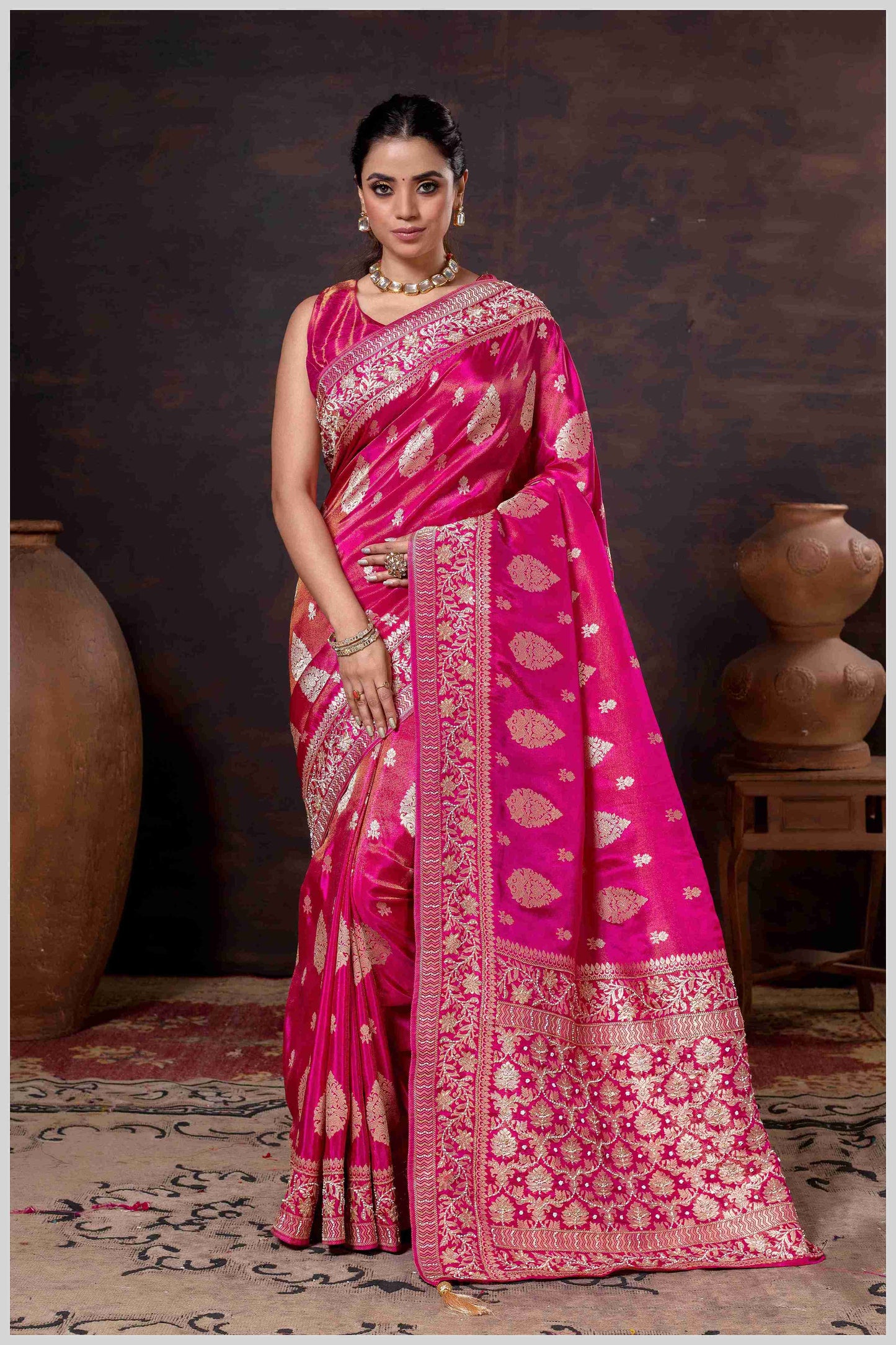 Pink Elegance: Tissue Silk Saree with Gold Zari Woven Details