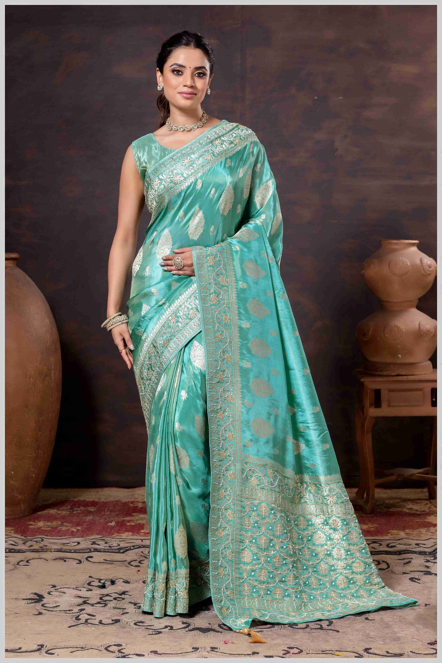 Aqua Elegance: Tissue Silk Saree with Gold Zari Woven Details