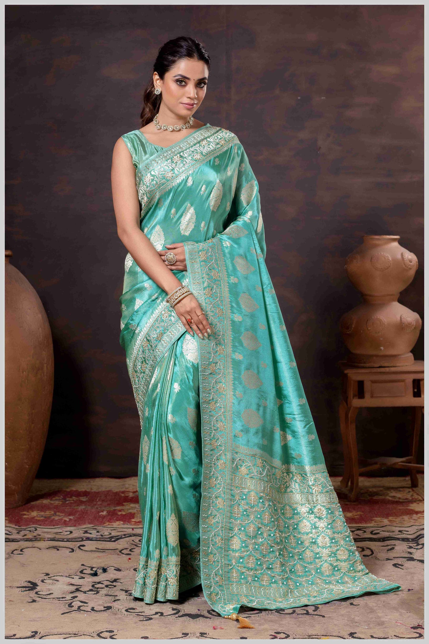 Aqua Elegance: Tissue Silk Saree with Gold Zari Woven Details