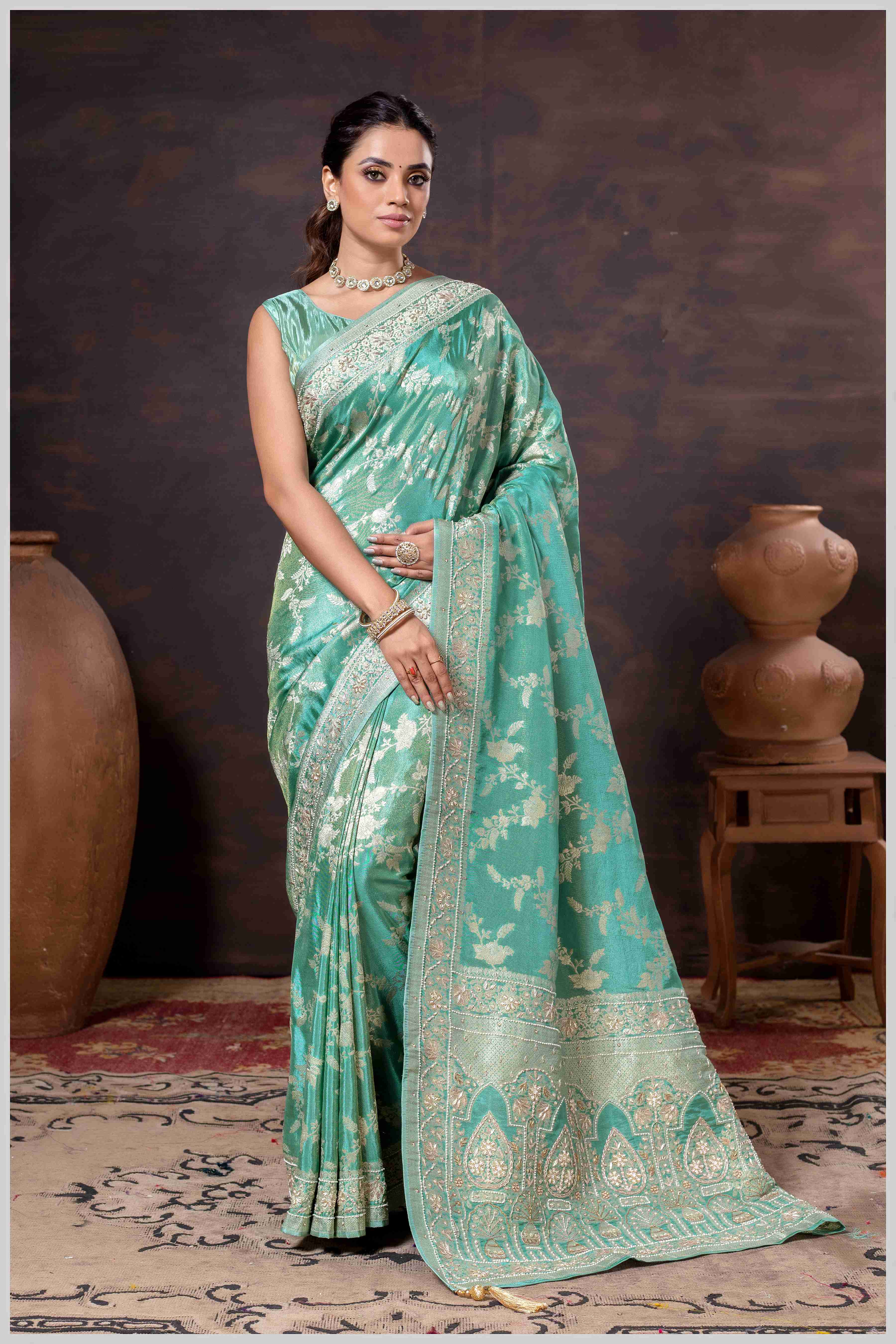 Grace in Bloom: Aqua Green Tissue Saree with Woven Floral Vines