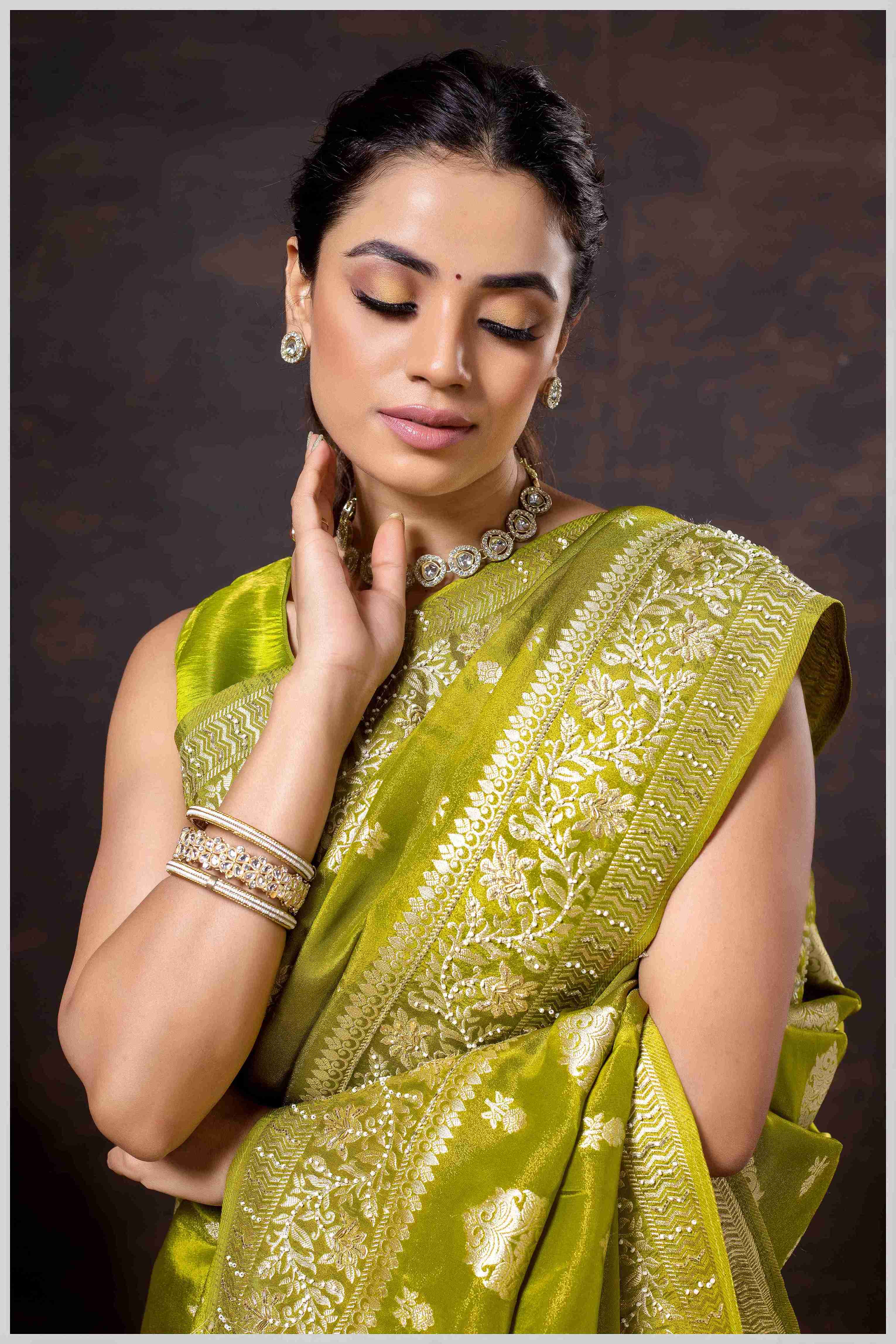 Mahendi Elegance: Tissue Silk Saree with Gold Zari Woven Details