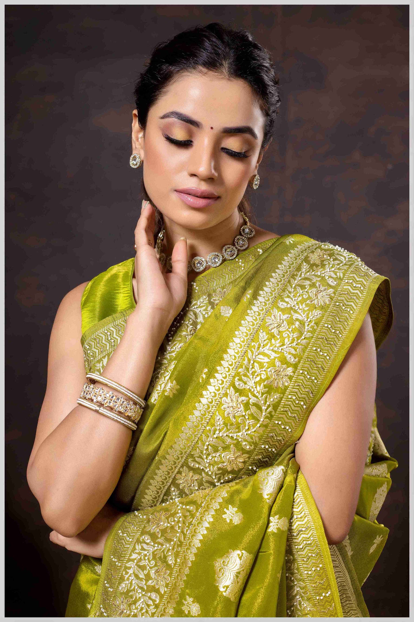 Mahendi Elegance: Tissue Silk Saree with Gold Zari Woven Details