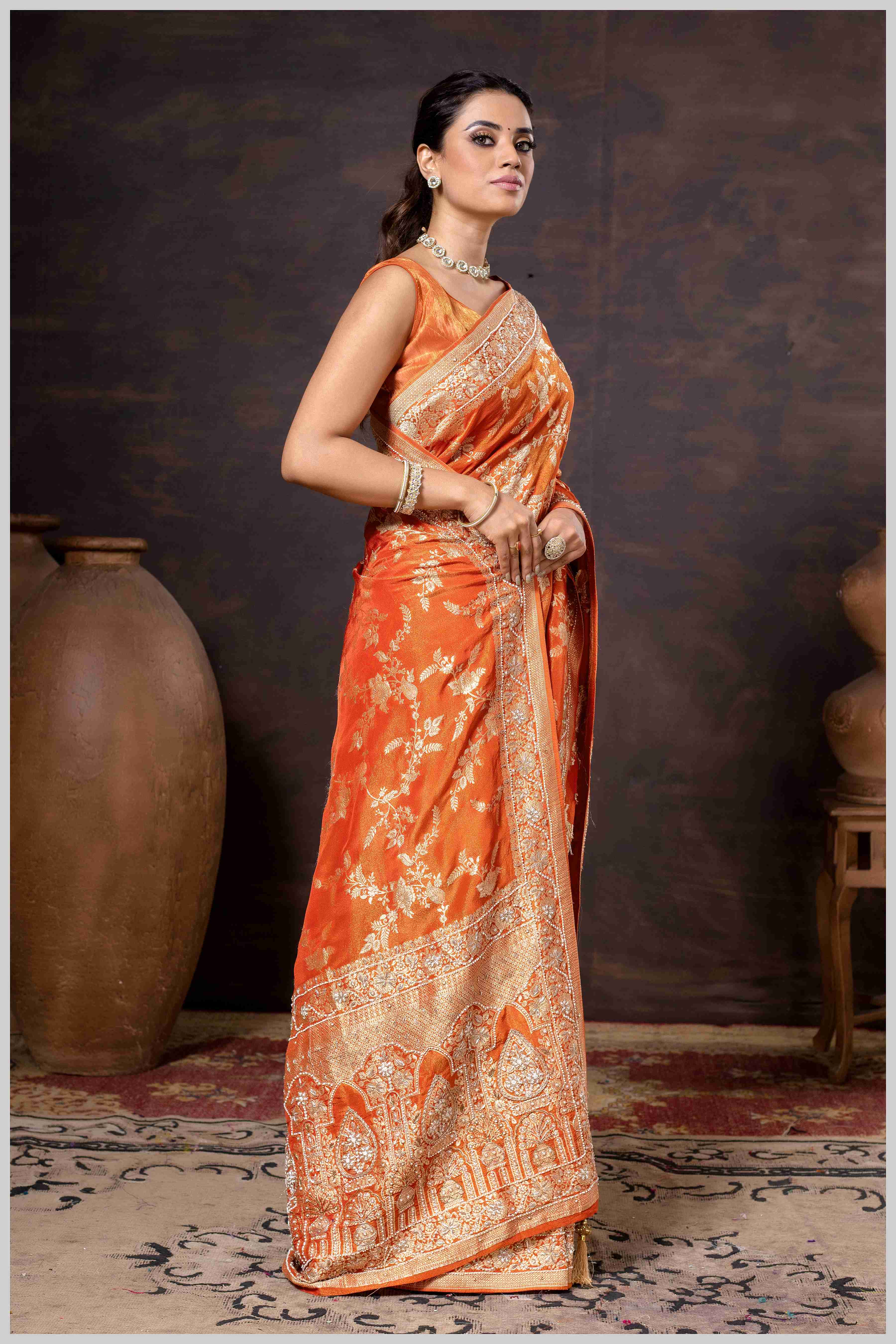 Grace in Bloom: Rust Orange Tissue Saree with Woven Floral Vines