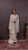 Off White Elegance: Tissue Silk Saree with Gold Zari Woven Details